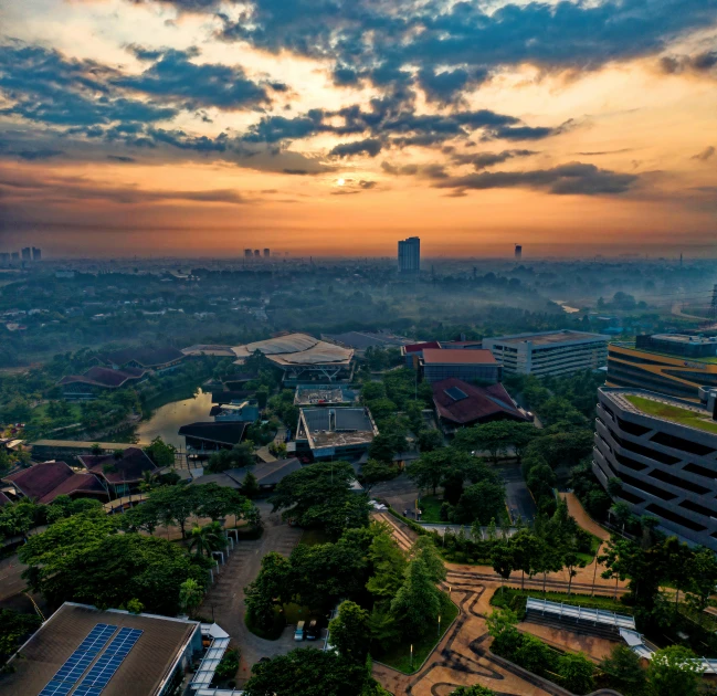 an aerial view of a city at sunset, by Erik Pevernagie, pexels contest winner, happening, indonesia, research complex, subtitles, hdr!