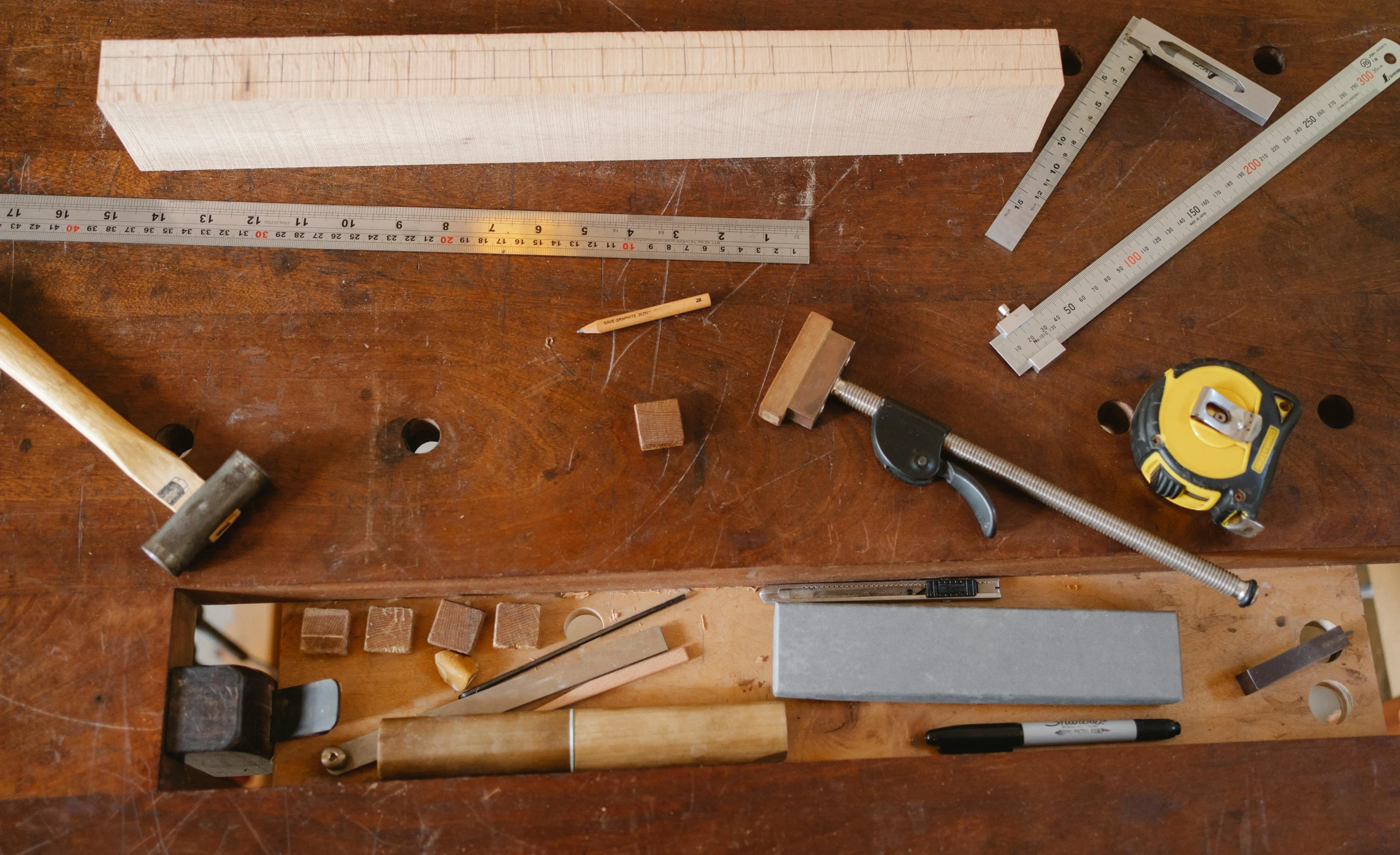 a group of tools sitting on top of a wooden table, robert kondo, square jaw-line, thumbnail, small manufacture