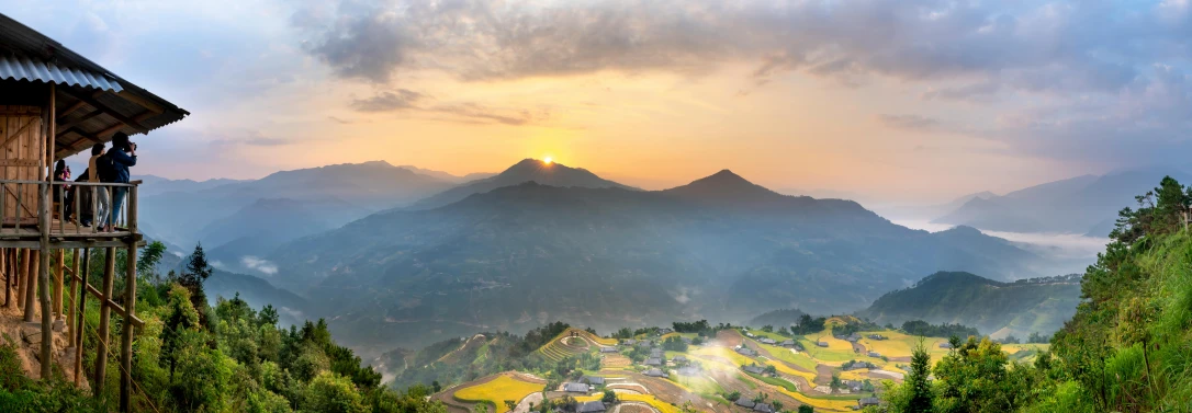 a couple of people standing on top of a mountain, pexels contest winner, sumatraism, patches of yellow sky, chinese village, rice paddies, “ aerial view of a mountain