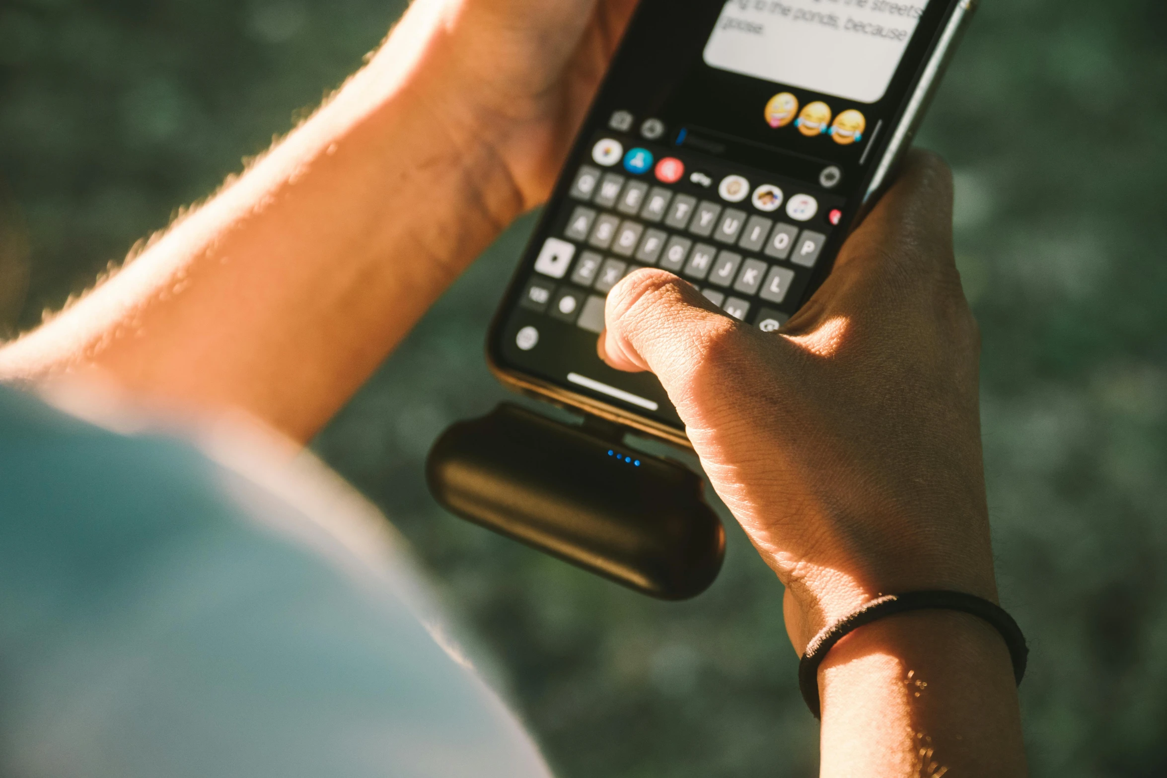 a close up of a person holding a cell phone, holding a battery, lofi vibe, all black matte product, glowwave