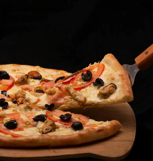 a pizza sitting on top of a wooden cutting board, by Carpoforo Tencalla, on a black background, giant wooden club, **cinematic, on a wooden tray