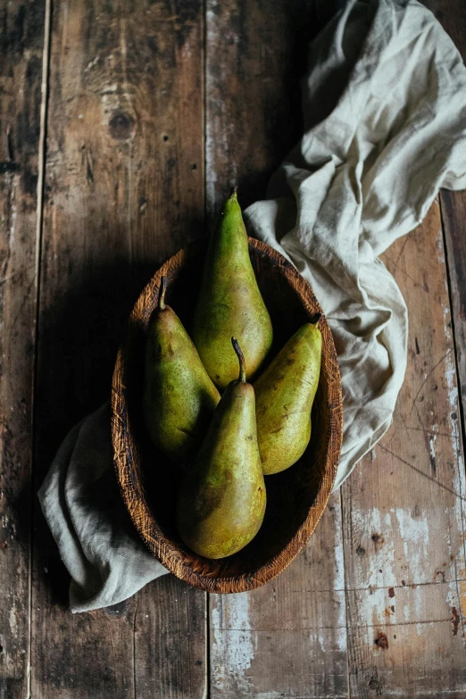 a bowl of pears on a wooden table, a still life, unsplash, portrait image, digital image, recipe, greens)