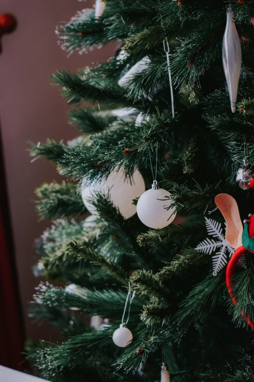 a close up of a christmas tree with ornaments, limbs, carson ellis, multi-part, plain