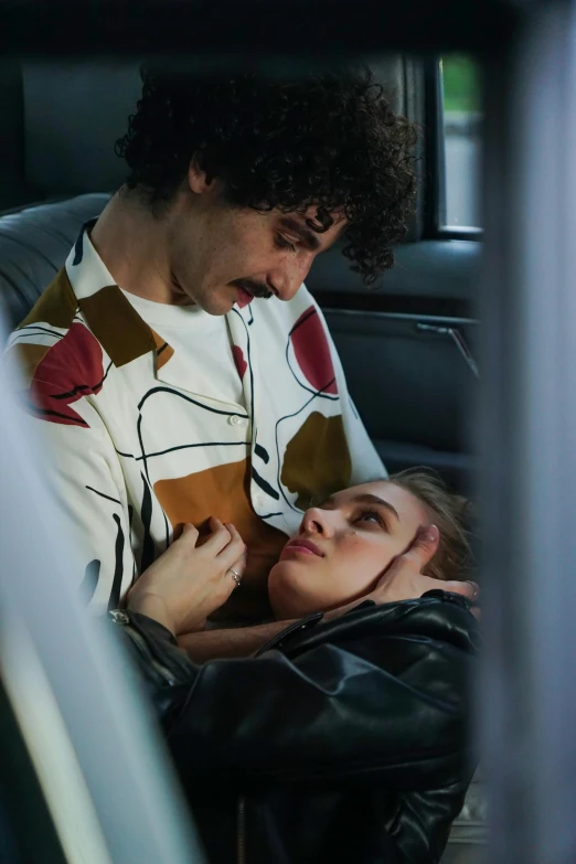 a man and a woman sitting in a car, an album cover, inspired by Nan Goldin, trending on pexels, serial art, patterned clothing, robert sheehan, portrait of annasophia robb, sleepy feeling