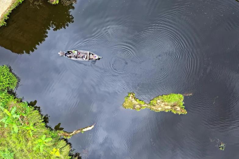 a couple of boats floating on top of a river, an album cover, pexels contest winner, top down extraterrestial view, scene from louisiana swamps, high definition screenshot, fishing