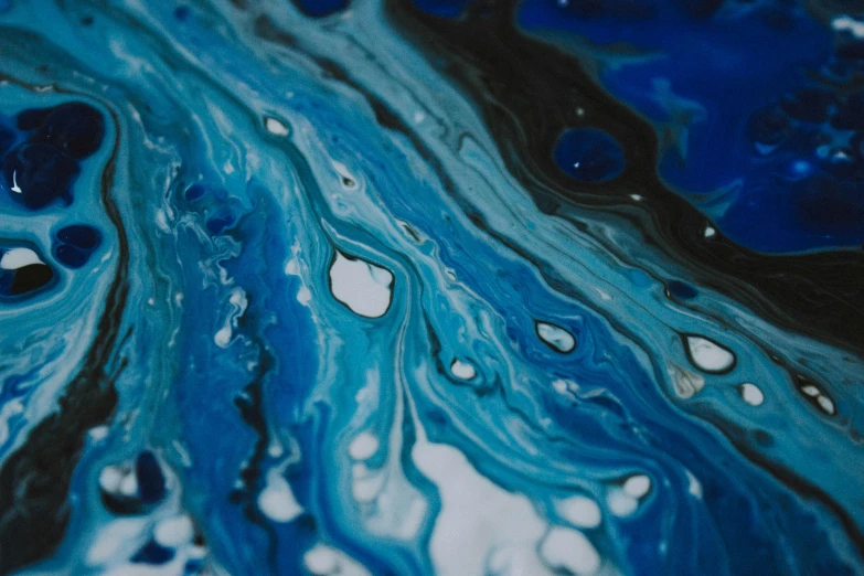 a close up of a blue and black fluid painting, trending on unsplash, birdseye view, looking left, water flow, painted marble sculptures
