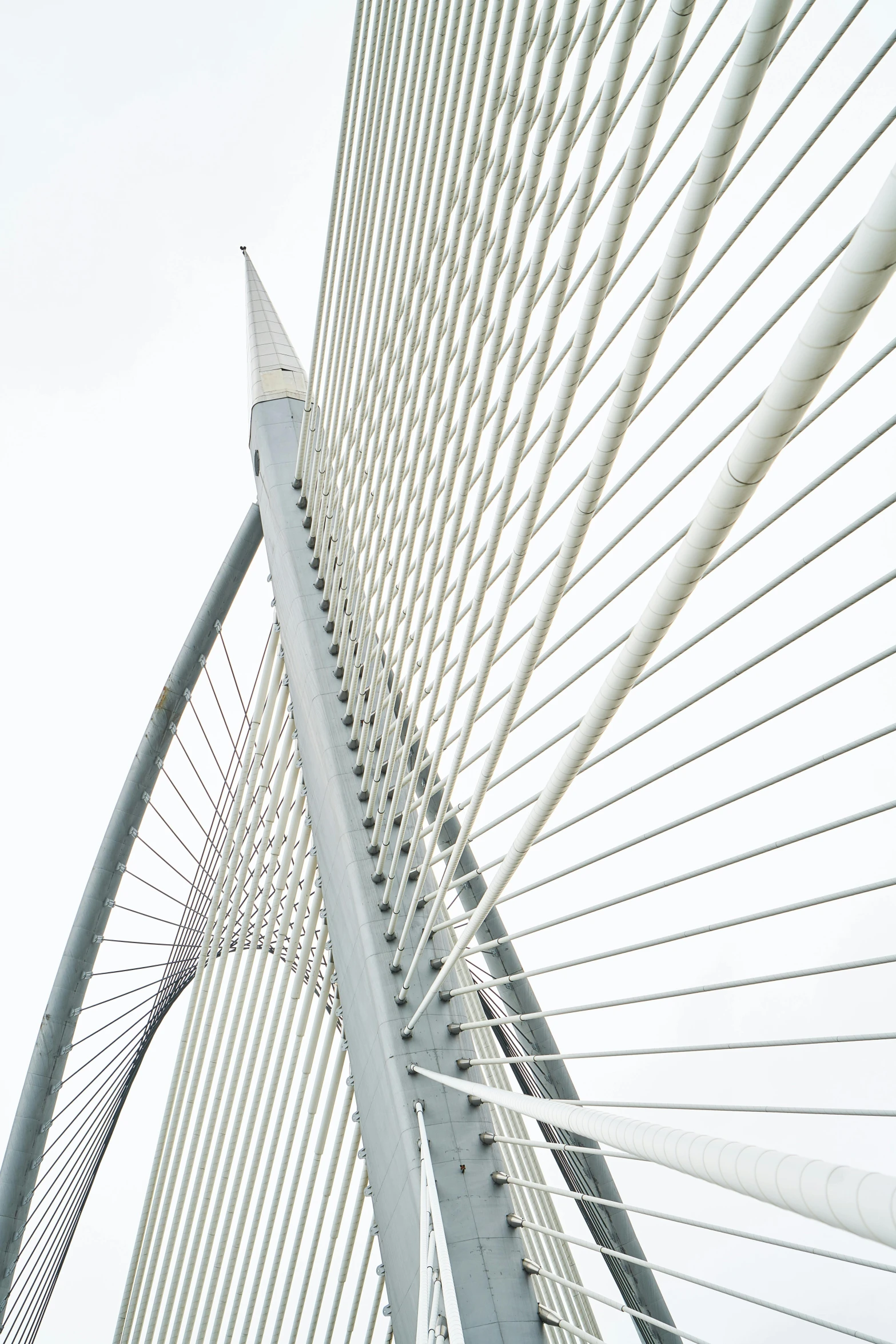 a close up of a bridge with a sky background, by Dave Melvin, minimalism, calatrava, cables on walls, large tall, idyllic