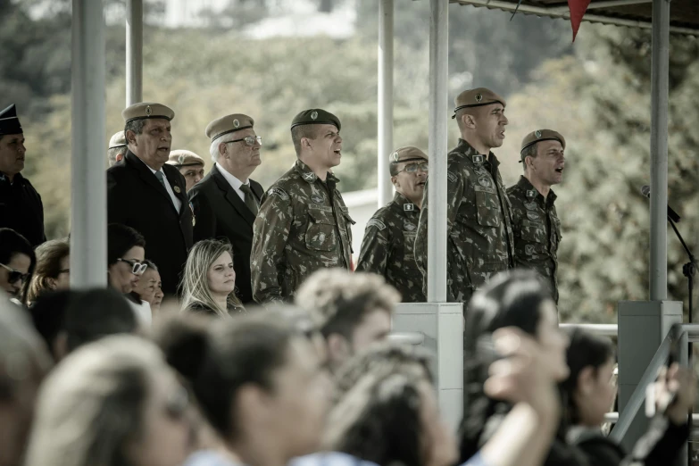 a group of military men standing next to each other, by Alejandro Obregón, unsplash, people enjoying the show, avatar image, chilean, portugal