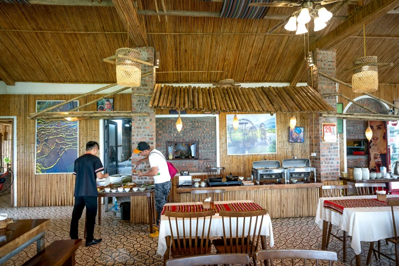 a couple of men standing next to each other in a restaurant, nuttavut baiphowongse, panoramic shot, avatar image