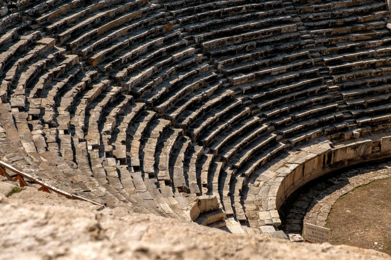 a bird sitting on top of a stone structure, an album cover, pexels contest winner, neoclassicism, sportspalast amphitheatre, the nine circles of hell, cyprus, photo of a big theaterstage