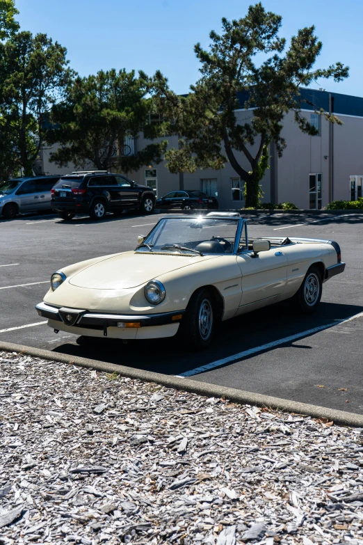 a car parked in a parking lot next to a parking meter, an album cover, unsplash, renaissance, soft top roof raised, alfa romeo project car, 1985 cheverlot k20 c10, iso 1 0 0 wide view