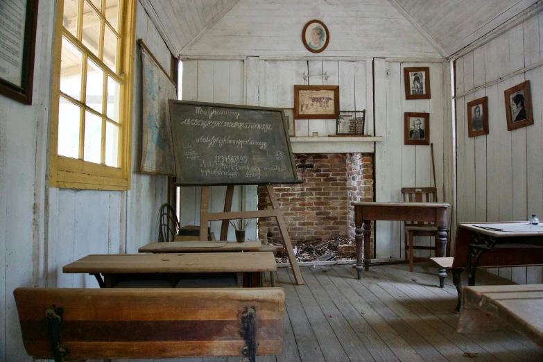 a classroom with wooden desks and a chalk board, by Jessie Algie, northwest school, whitewashed buildings, colonial, an film still, in louisiana