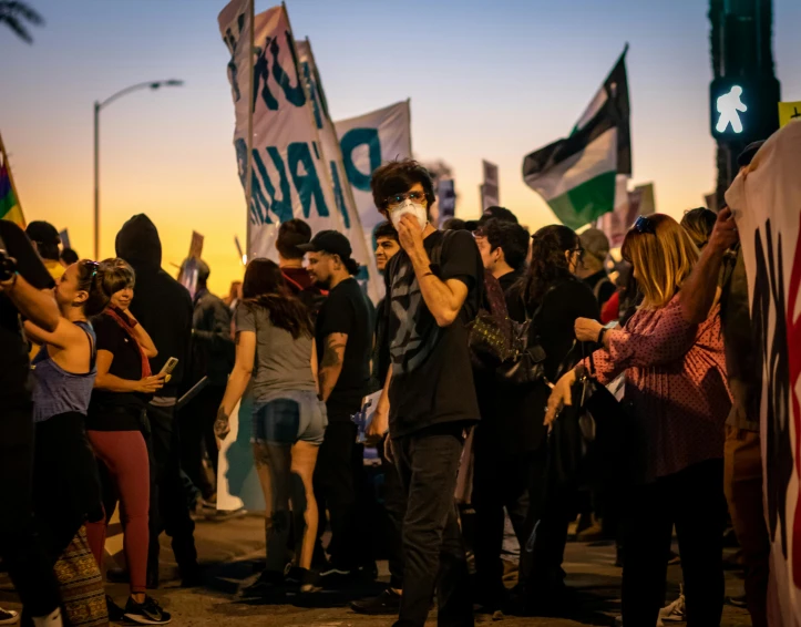 a group of people that are standing in the street, golden dawn, buenos aires, raphael personnaz, tense