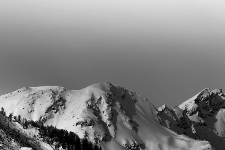 a black and white photo of a snow covered mountain, figuration libre, cinematic 4 k wallpaper, taken on iphone 1 3 pro, whistler, monochrome color