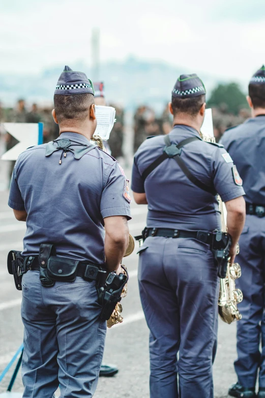 a group of police officers standing next to each other, by Adam Marczyński, shutterstock, happening, 🚿🗝📝