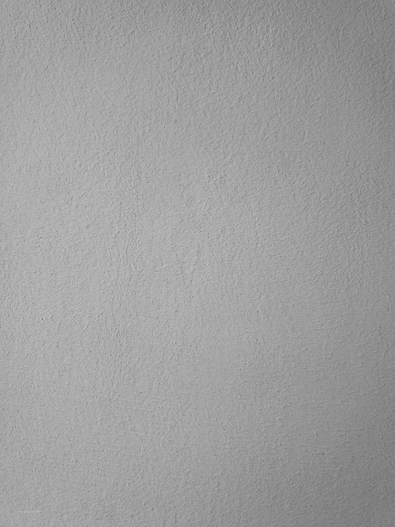 a black and white photo of a clock on a wall, a minimalist painting, inspired by Agnes Martin, pexels, detail texture, 144x144 canvas, gray color, wall painting