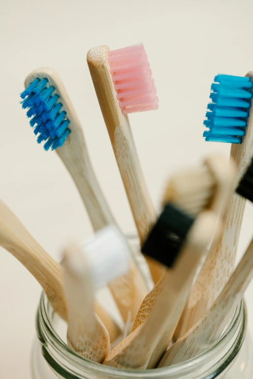 a jar filled with toothbrushes sitting on top of a table, profile image, bamboo, thumbnail, units