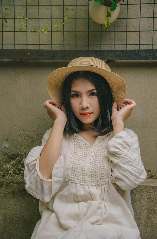 a woman sitting on the ground wearing a hat, by Tan Ting-pho, pexels contest winner, renaissance, cream colored peasant shirt, halfbody headshot, ulzzang, portrait symetrical