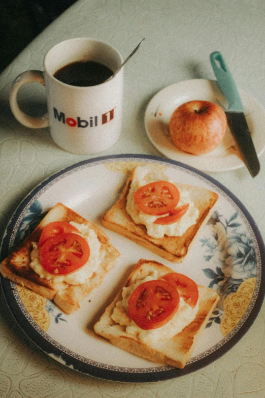 a plate of food on a table next to a cup of coffee, inspired by Gillis Rombouts, trending on reddit, photorealism, toast, vintage color photo, 1999 photograph, plenty mozzarella