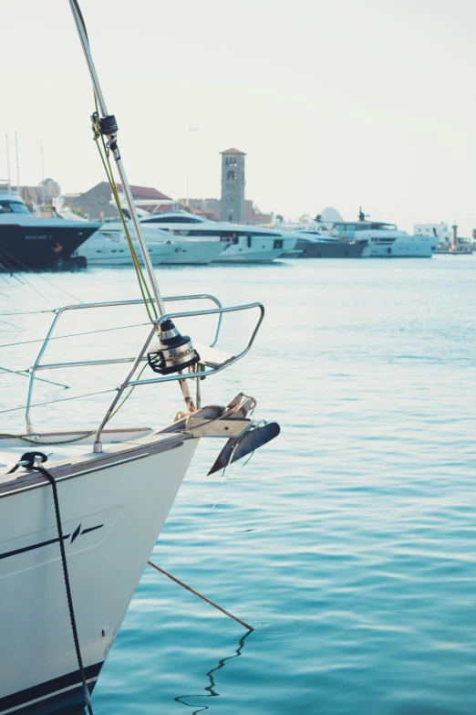 a white boat sitting on top of a body of water, happening, on a yacht at sea, surrounding the city, shot on hasselblad, egypt