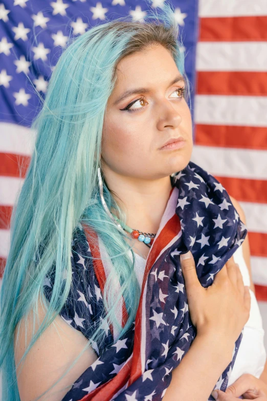 a woman with blue hair holding an american flag, inspired by Elsa Bleda, smug look, dyed hair, age 2 0, promo image