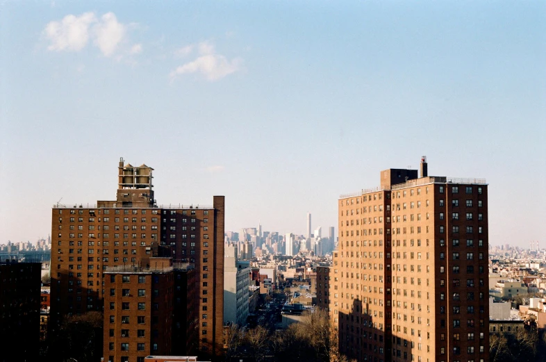 a view of a city from a high rise building, inspired by Thomas Struth, unsplash, harlem renaissance, ignant, slightly sunny, landscape photo