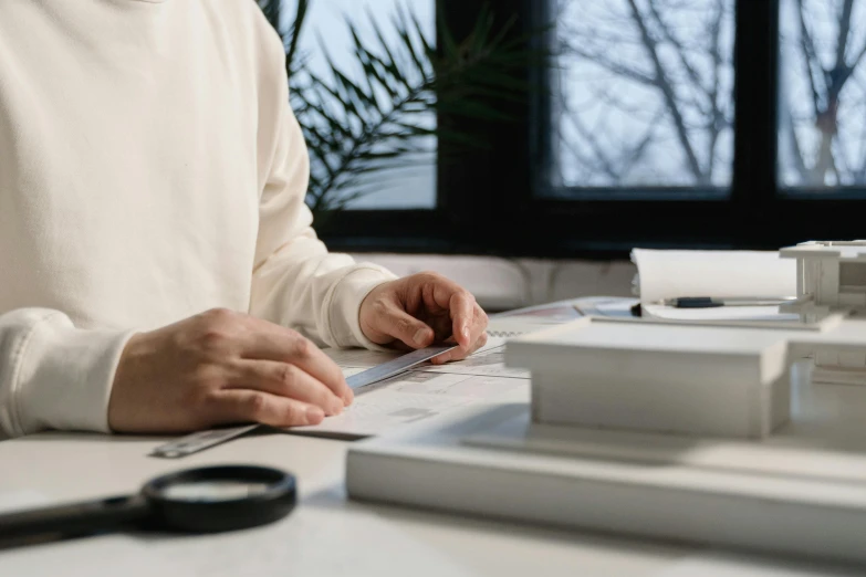 a man sitting at a desk using a laptop computer, a drawing, pexels contest winner, sustainable materials, 9 9 designs, attention to detail, straight edges