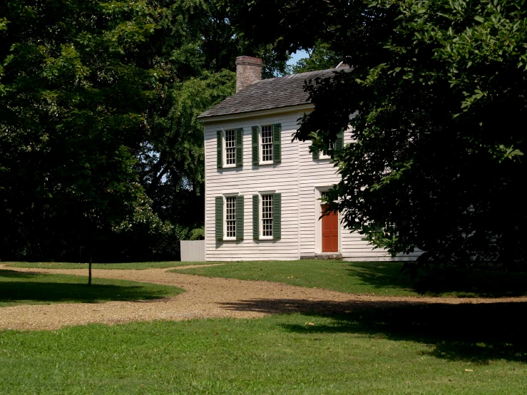 a white house sitting on top of a lush green field, preserved historical, henry dorsett case, slide show, colonial exploration