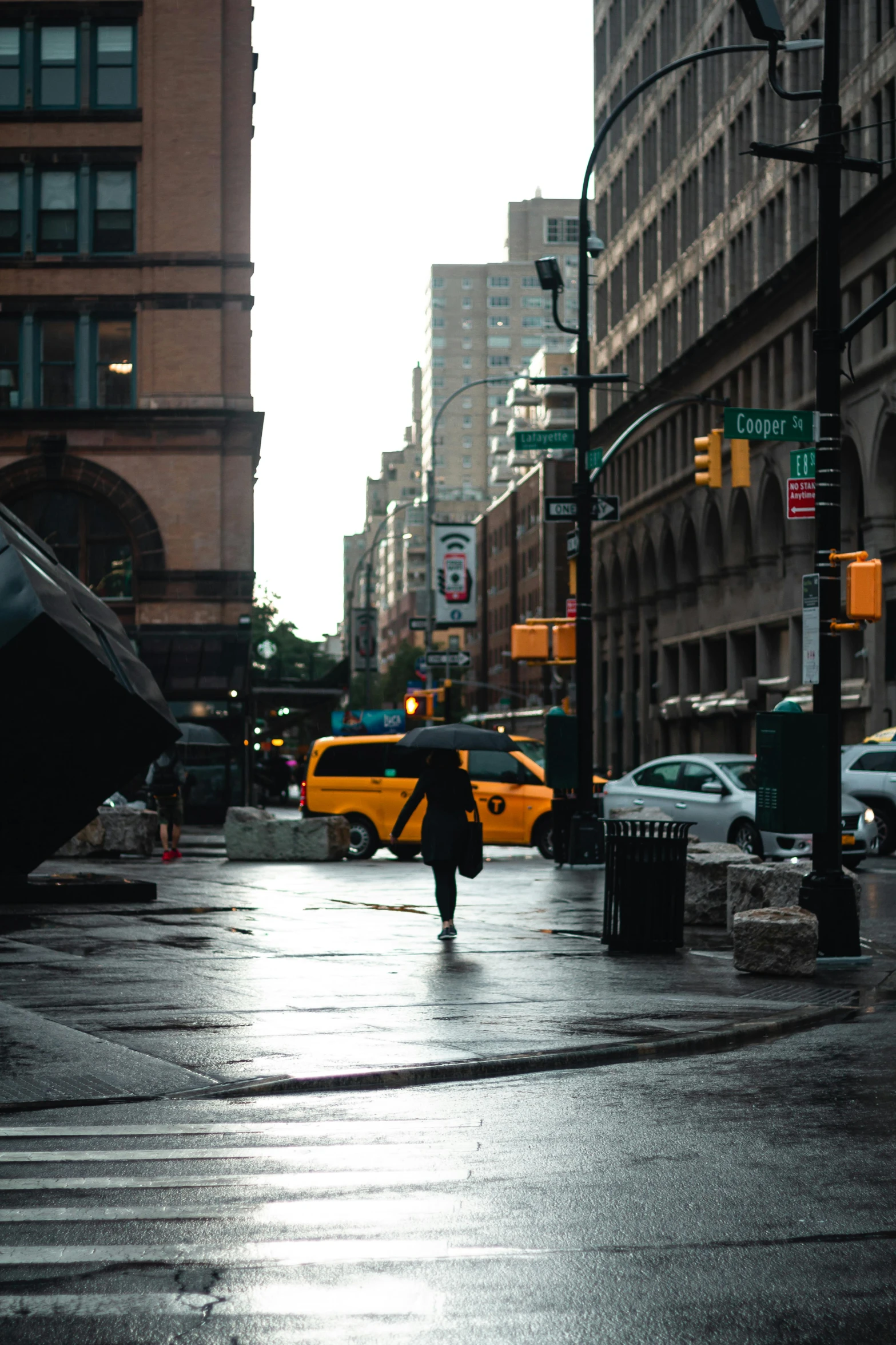 a person walking in the rain with an umbrella, golden hour in manhattan, empty streetscapes, unsplash 4k, multiple stories