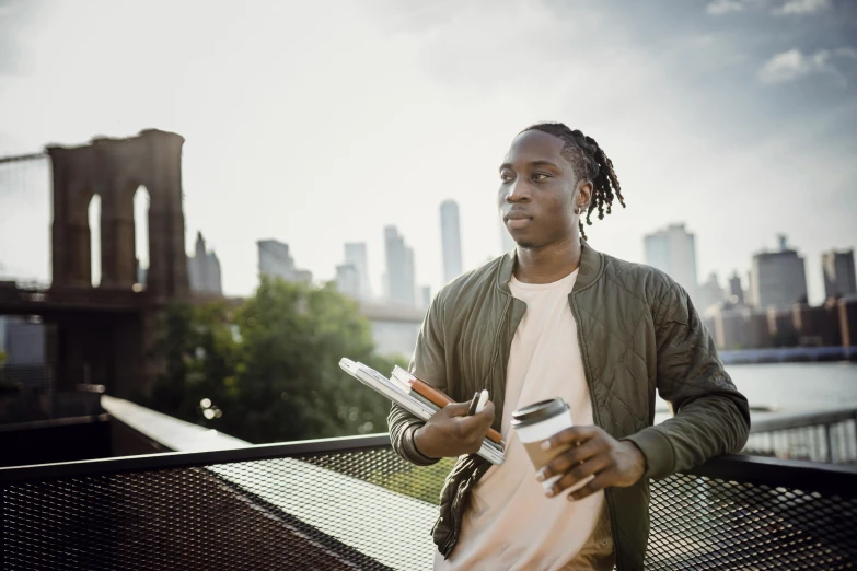 a man standing on top of a bridge holding a knife and fork, pexels contest winner, handsome hip hop young black man, attractive man drinking coffee, humans of new york, looking outside