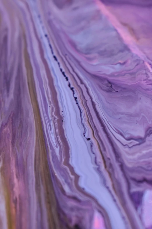 a piece of marble sitting on top of a table, inspired by Julian Schnabel, unsplash, abstract art, ((purple)), made of liquid, intricate oil painting detail, opalescent