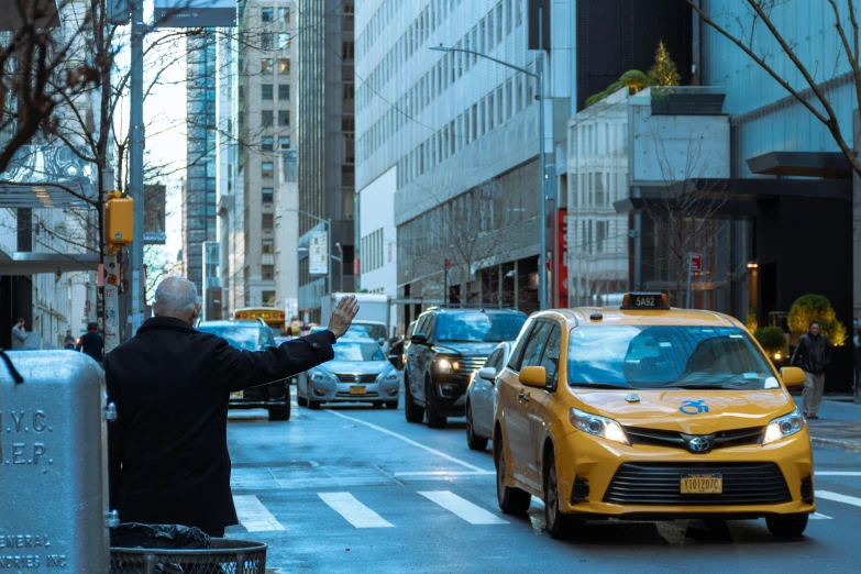 a man directing traffic on a busy city street, by Emanuel Witz, pexels contest winner, madison square garden, waving, taxi, thumbnail