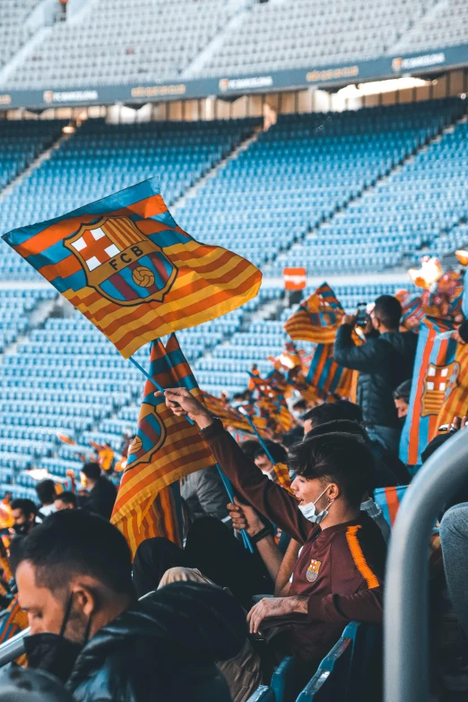 a group of people holding flags in a stadium, pexels contest winner, happening, fc barcelona, 2 5 6 x 2 5 6, amber and blue color scheme, terraced