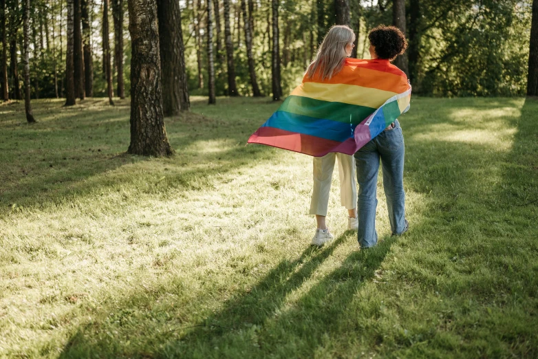 a man and a woman holding a rainbow flag, pexels, renaissance, in the park, two women, cottagecore, full body image