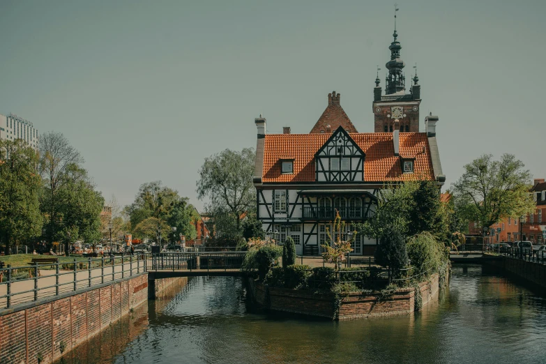 a building sitting on top of a river next to a bridge, by Jan Tengnagel, timbered house with bricks, polish hyper - casual, in the center of the image, swanland