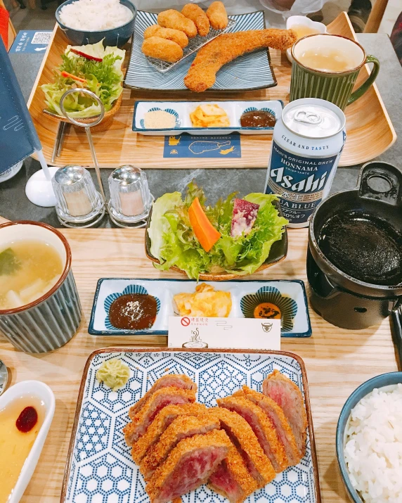a wooden table topped with plates of food, inspired by Kanō Tan'yū, unsplash, dau-al-set, 😭 🤮 💕 🎀, blue gray, shogakukan, thumbnail
