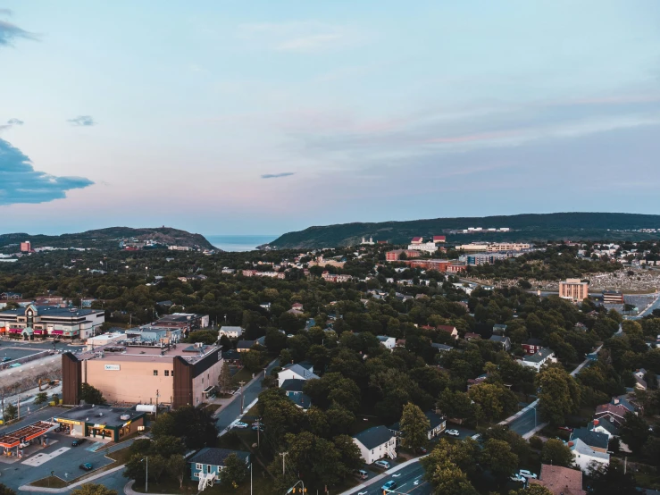 an aerial view of a city at dusk, a photo, by Carey Morris, pexels contest winner, happening, craigville, summer evening, cornell, seaview