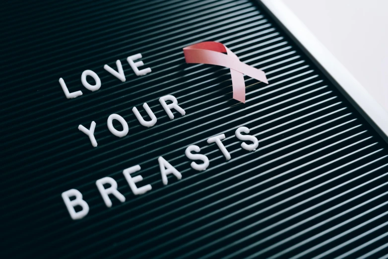 a letter board with a pink ribbon on it, nipple, formless brests, no blur, diverse