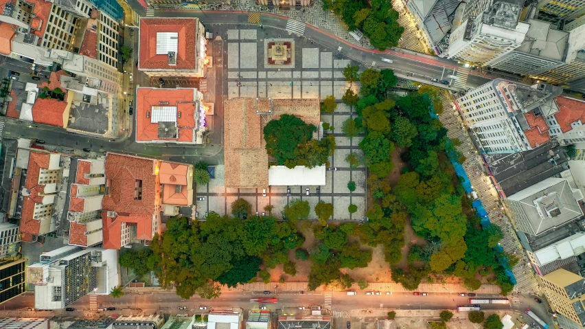 an aerial view of a city at night, by Luis Miranda, pexels contest winner, renaissance, in a square, brazil, green spaces, taken at golden hour