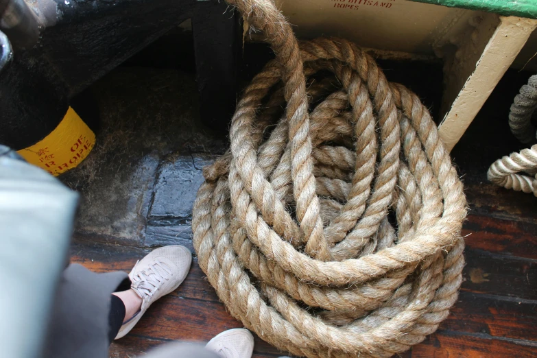 a close up of a rope on a boat, by Helen Stevenson, hurufiyya, look down a cellar staircase, laura watson, max dennison, hyperealistic photo