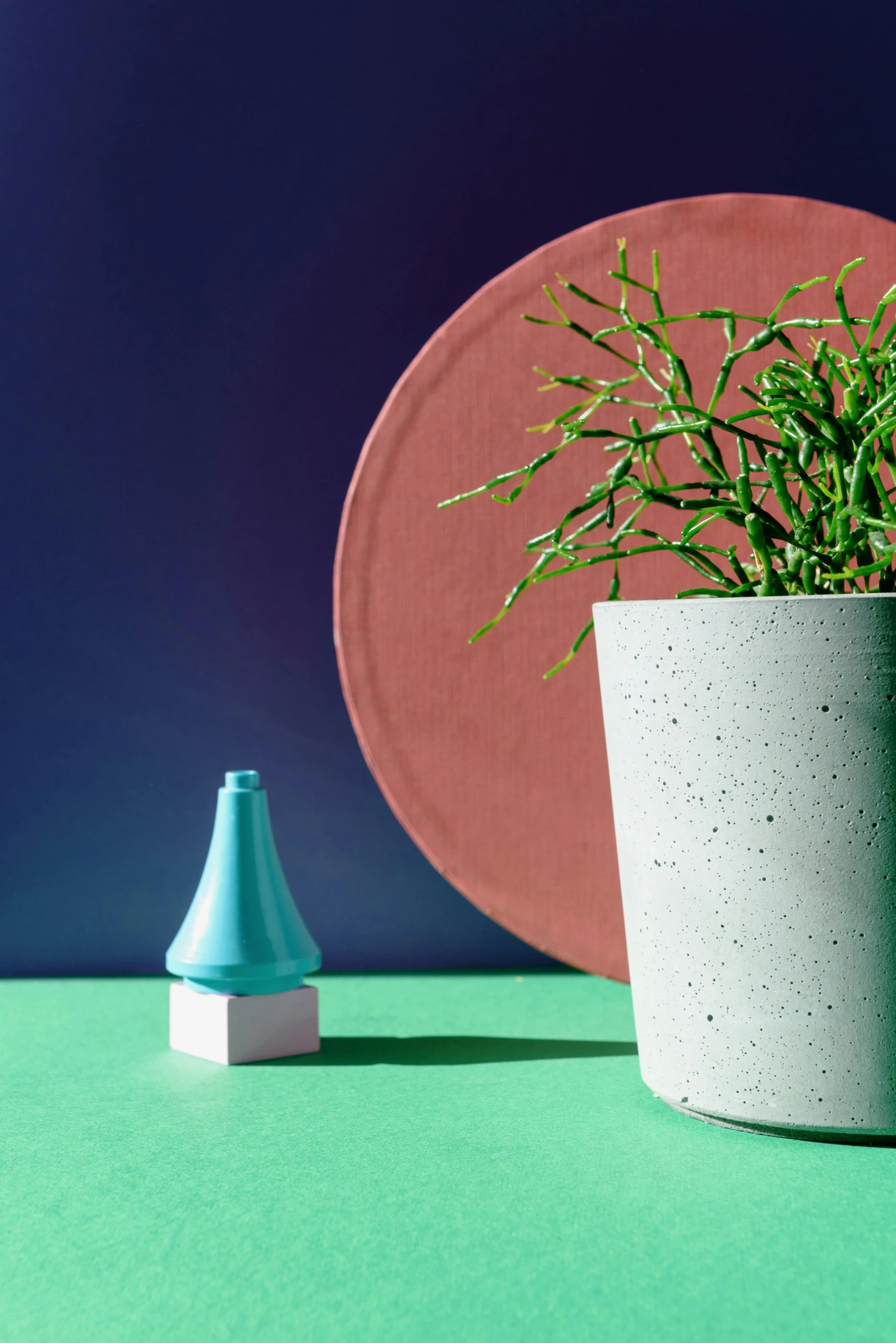a potted plant sitting on top of a green table, an abstract sculpture, inspired by Hendrik Gerritsz Pot, concrete art, blue neon accents, pointy conical hat, textured base ; product photos, matte bright colors