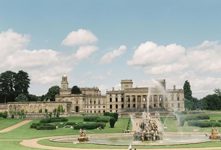 a large building with a fountain in front of it, pexels contest winner, rococo, crewdson, summer day, english heritage, mint