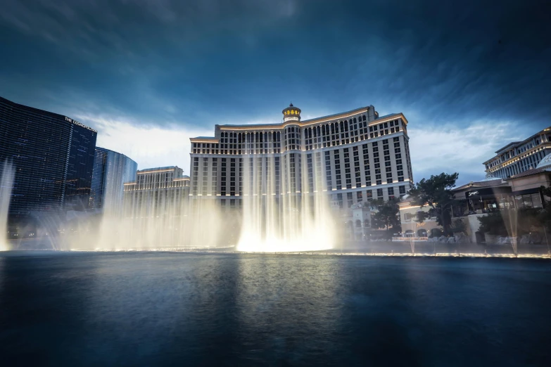 a large fountain in the middle of a body of water, by Dan Luvisi, pexels contest winner, renaissance, las vegas, thumbnail, stacked image, 8k resolution”