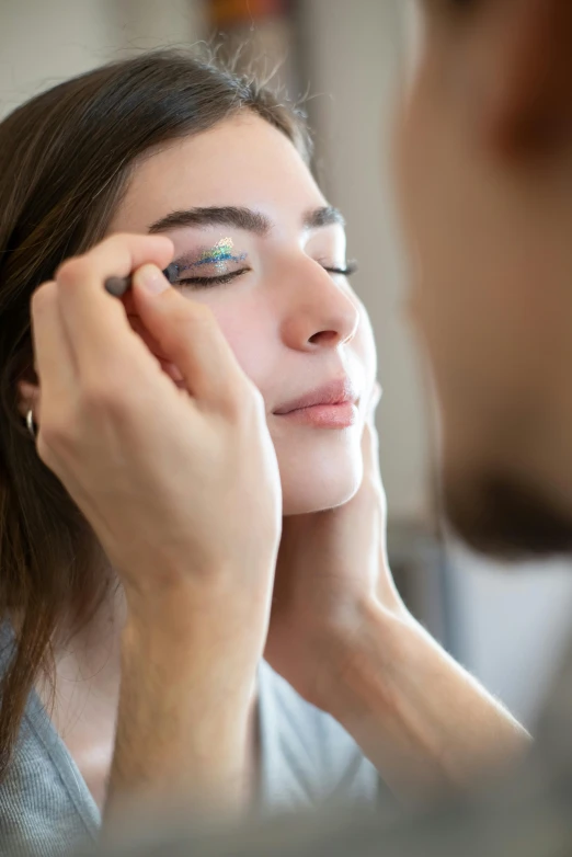 a woman getting her make up done in front of a mirror, a stipple, trending on pexels, iridescent titanium, grid of eye shapes, profile pic, ilustration