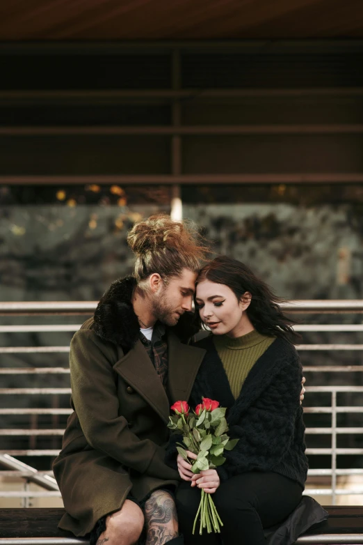 a man and woman sitting on a bench next to each other, a photo, trending on pexels, renaissance, holding flowers, two men hugging, brown haired, digital image