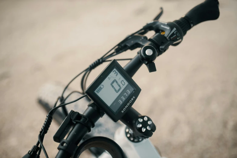 a close up of the handlebars of a bike, a portrait, unsplash, lcd screen, white finish, full product shot, full daylight