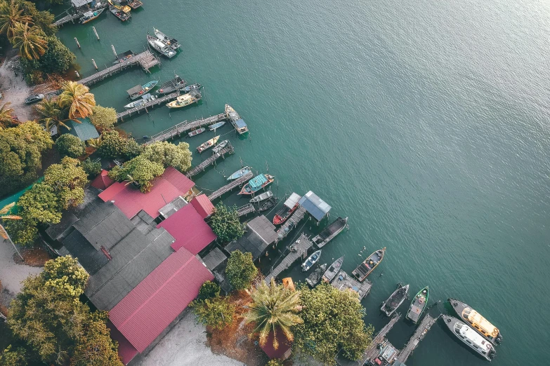 a group of boats sitting on top of a body of water, pexels contest winner, hurufiyya, flatlay, malaysian, small dock, view from the side”