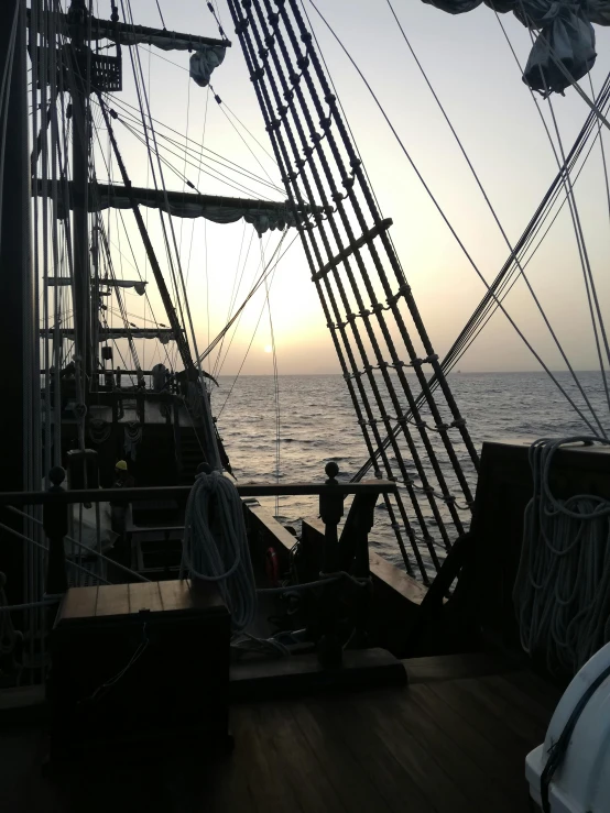 a view of the ocean from the deck of a ship, inspired by Willem van de Velde the Younger, romanticism, at dusk!