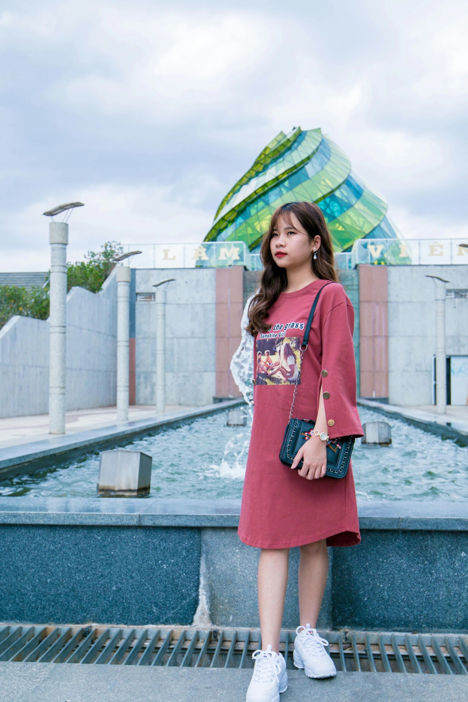 a woman standing in front of a fountain, a picture, inspired by Kim Jeong-hui, happening, cute casual streetwear, amy rose red dress, high resolution photo, square