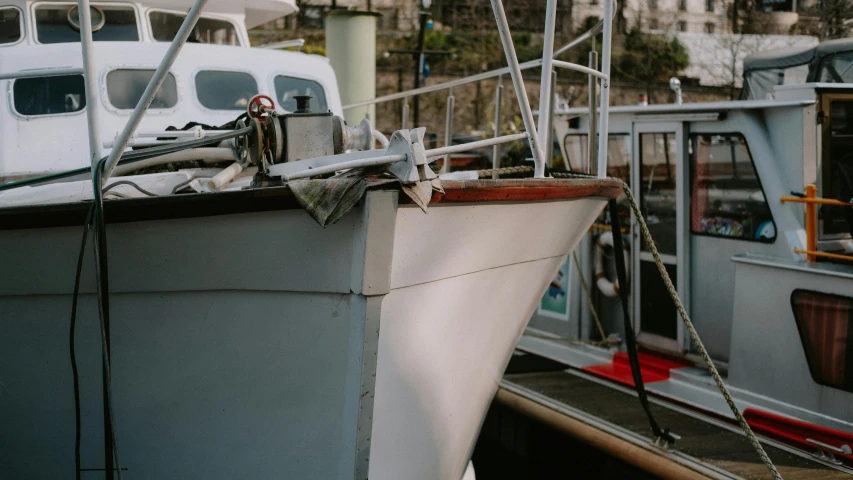 a couple of boats parked next to each other, pexels contest winner, photorealism, white mechanical details, prop, 3 5 mm photo